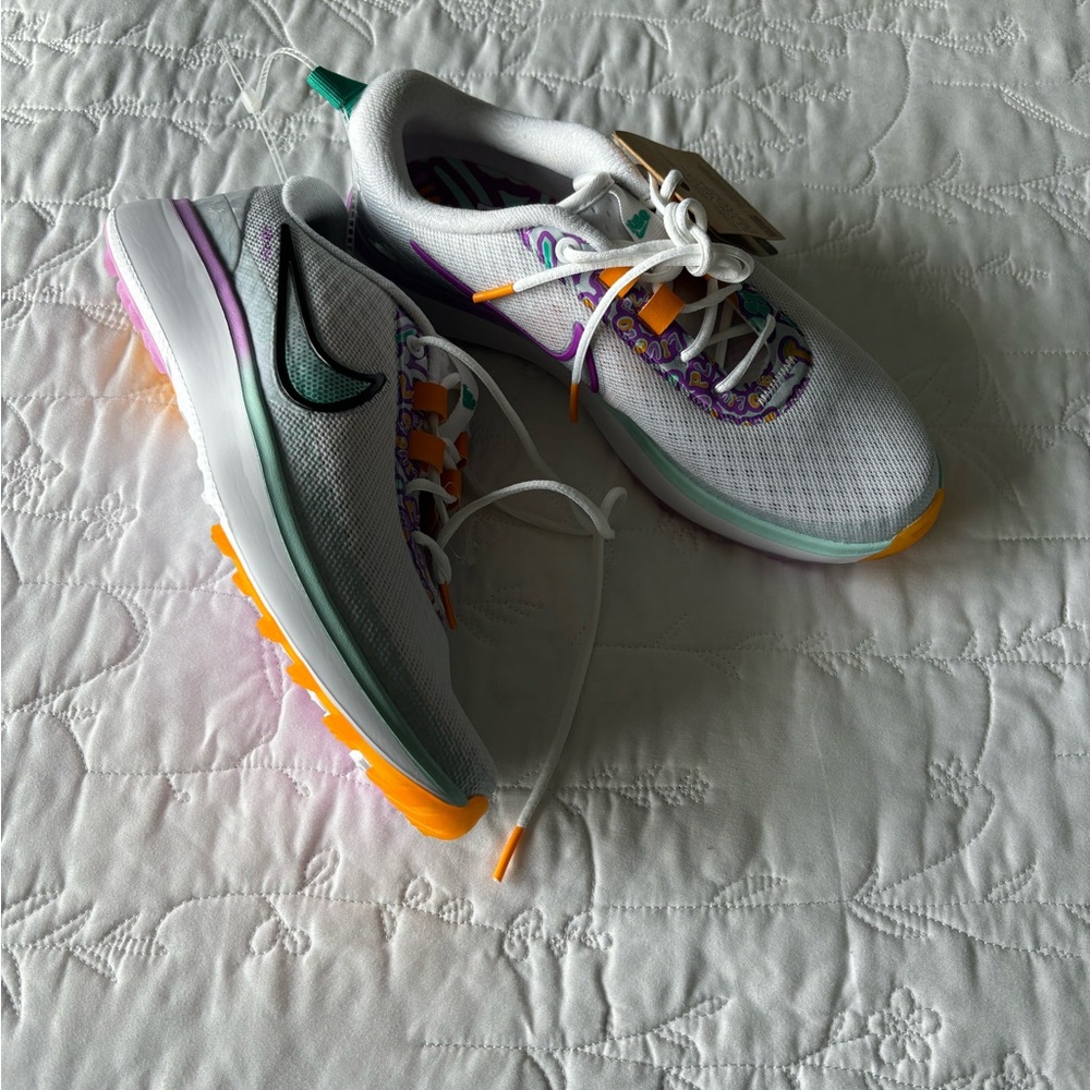 Nike White and Purple Sneakers with Lightweight Upper and Sleek Design